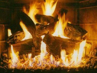 Logs making large fire on fireplace — Freehold, NJ — Fireside Pros