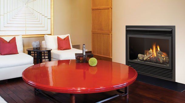 Fireplace in front of red table — Freehold, NJ — Fireside Pros