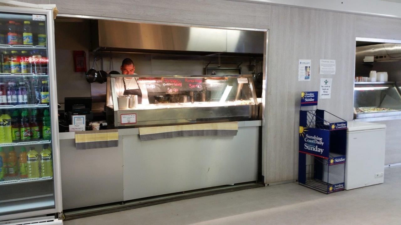 Man Serving Food — Palm Beach, QLD — Container Kitchens & Shops