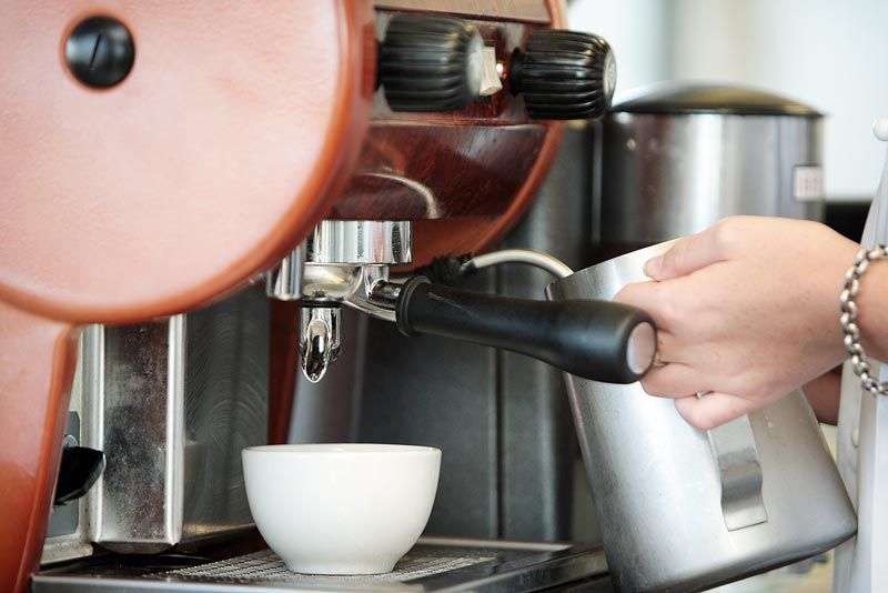 Coffee Machine — Palm Beach, QLD — Container Kitchens & Shops