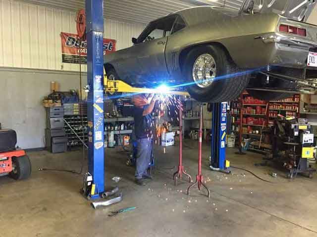 Mechanic Repairing a Lifted Car — Newark, OH — Eric’s Complete Auto Repair