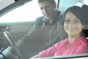 Young Attractive Couple Driving A Car — Chicago, IL — Clover Insurance Agency