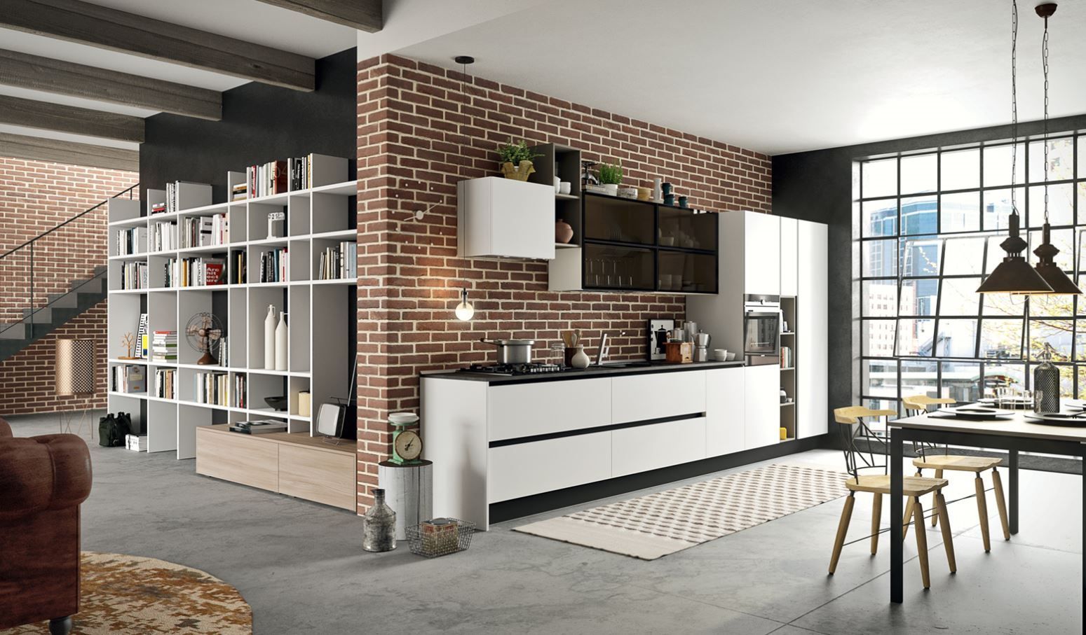 Cucina moderna con parete in mattoni, mobili bianchi e libreria, adiacente alla zona pranzo.