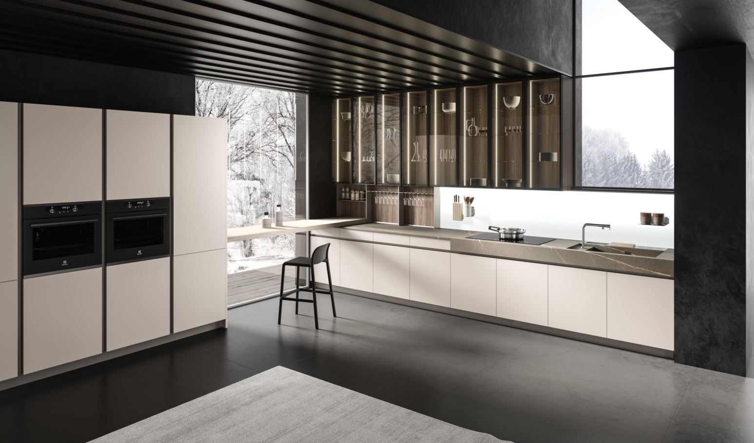 Cucina moderna Aran con mobili chiari, dettagli scuri e una vista esterna innevata.