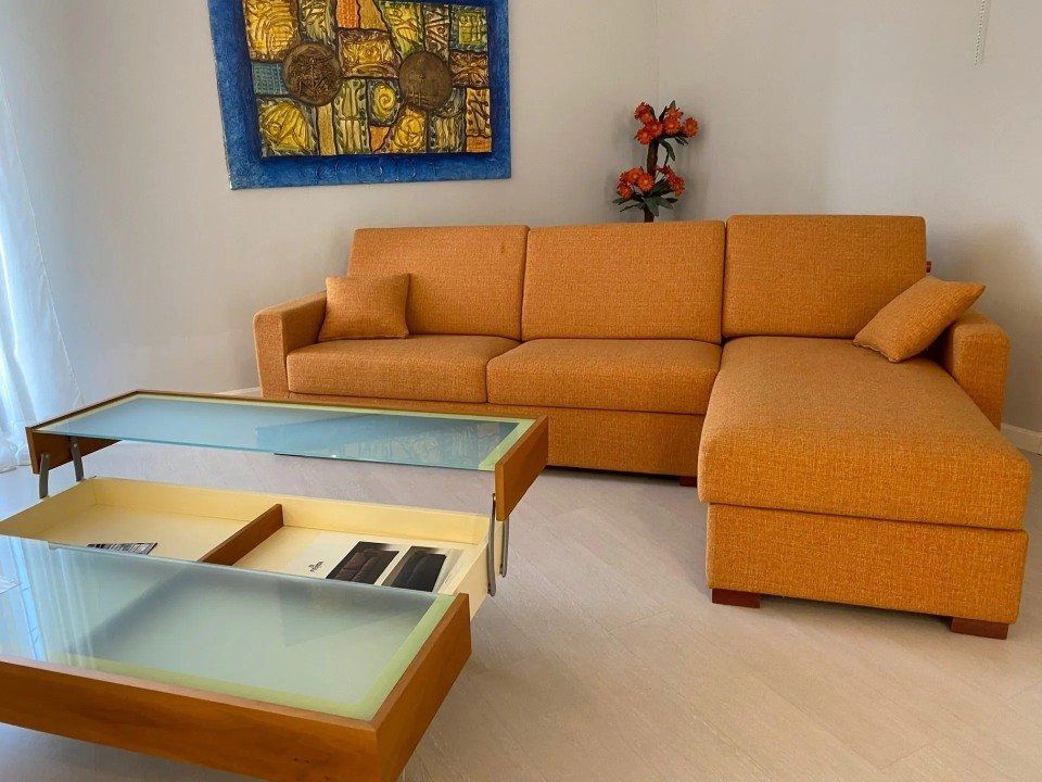 Salotto angolare in pelle con penisola