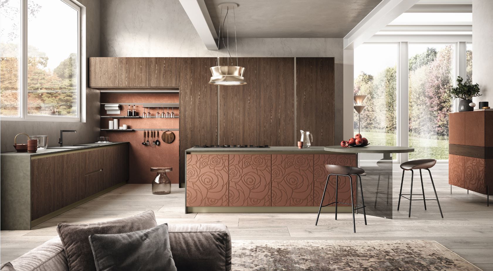 Cucina moderna Moretti Compact con mobili in rame e isola; in primo piano c'è un divano.