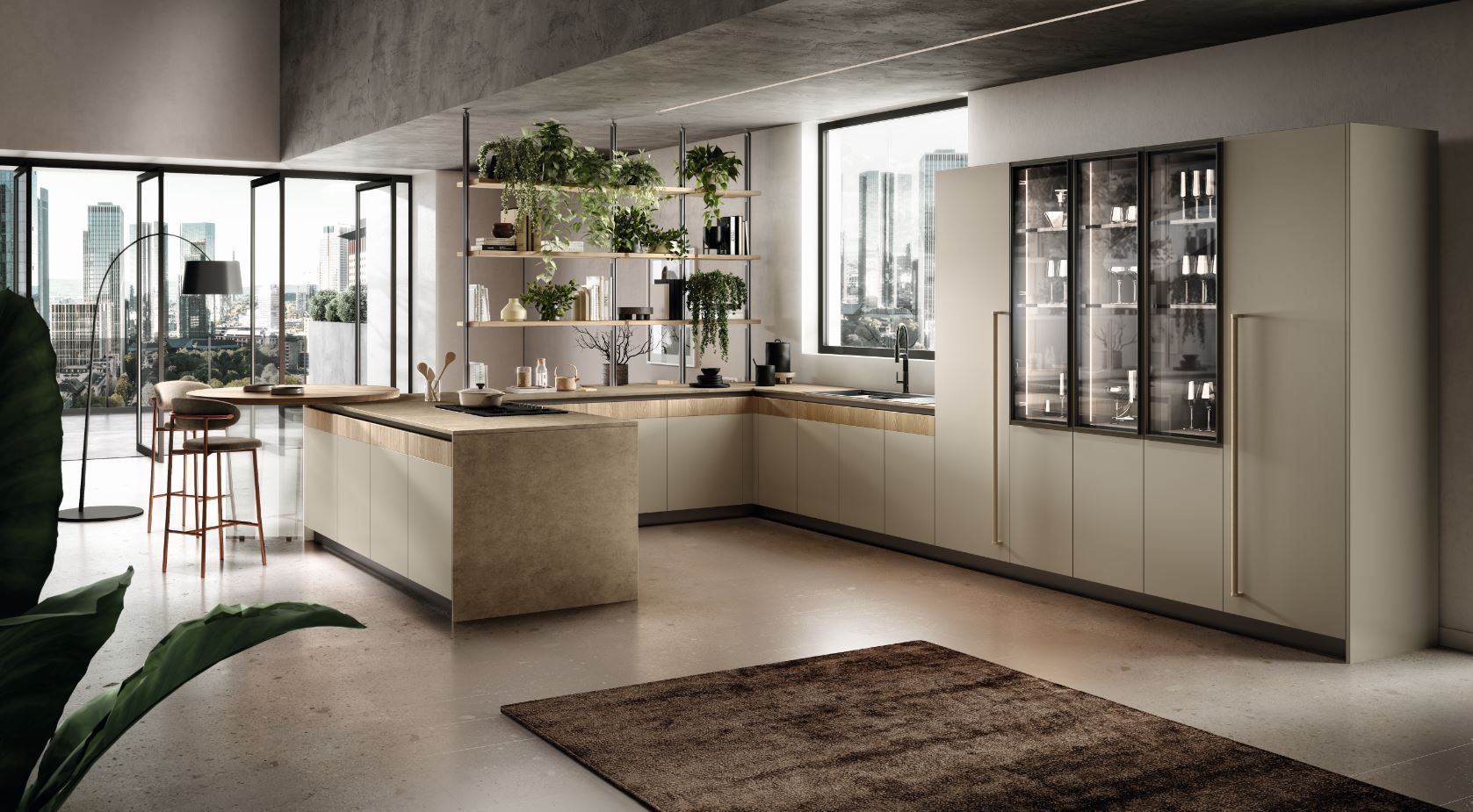 Cucina moderna con isola, mobili e vetrina, immersa nella luce naturale.