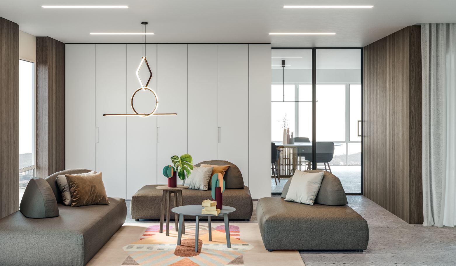 Soggiorno moderno con divani modulari grigi, tavolini da caffè e lampada a sospensione.