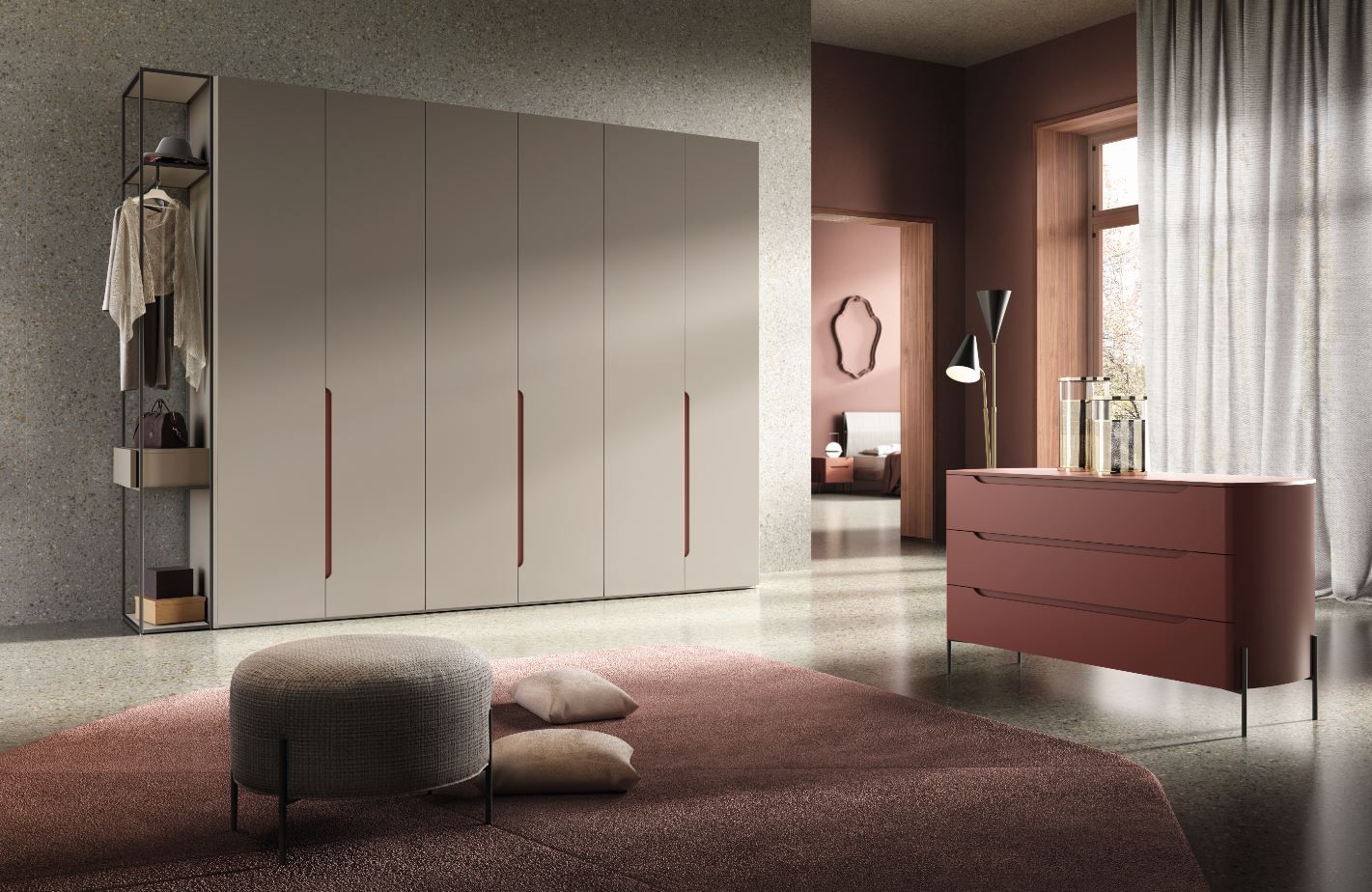 Camera da letto con armadio color tortora, cassettiera rosa, tappeto e scaffalatura a giorno; toni tenui e neutri.