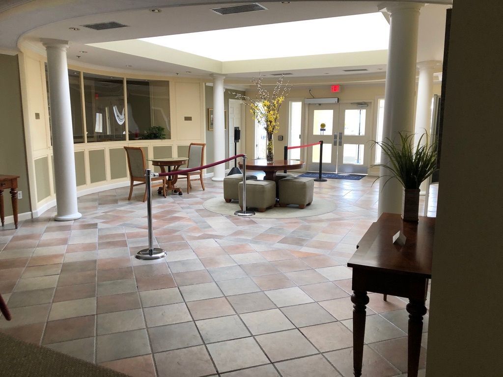 Spotless lobby with polished tile flooring and welcoming decor after commercial cleaning in Barnstable, MA.