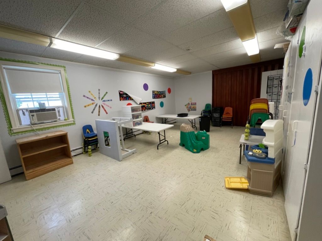 Organized and sanitized school classroom with clean floors and educational toys in Barnstable, MA.