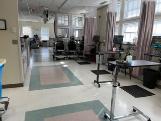 A hospital hallway with a sign that says exit