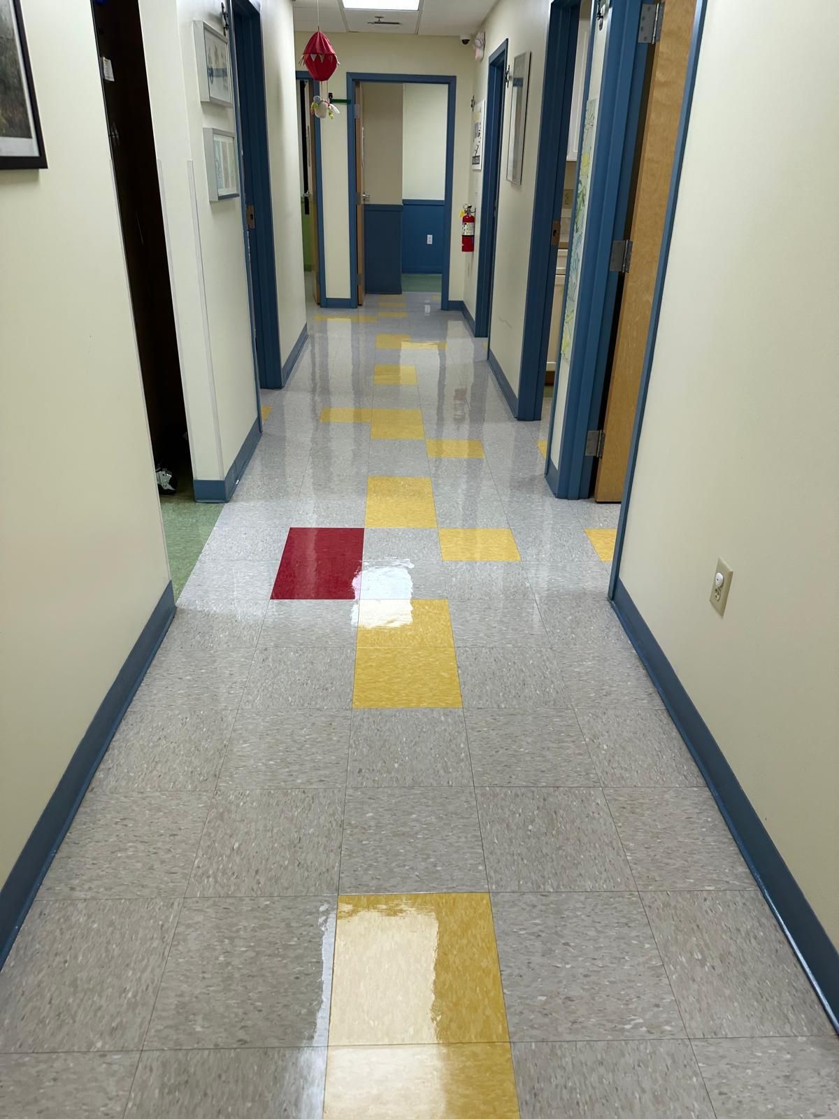Waiting room with spotless, glossy floors in a healthcare environment