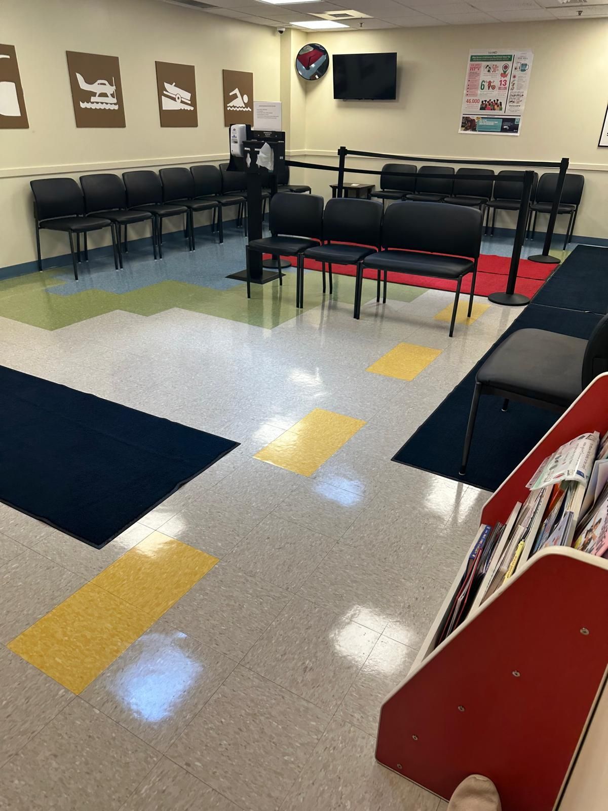 Floor cleaning in colorful hallway of a pediatric or daycare center