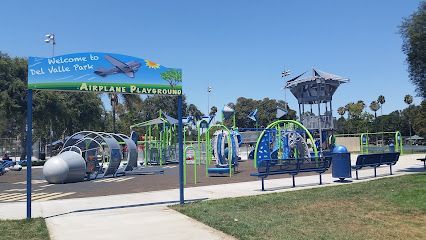 Tree service close to me-Sign for Vista Del Valle Park with landscaping and roadway.