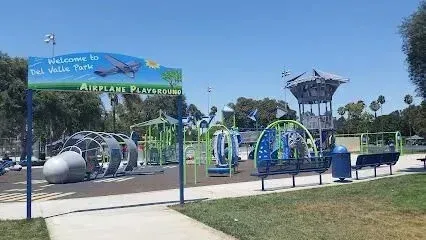Tree service close to me-Sign for Vista Del Valle Park with landscaping and roadway.