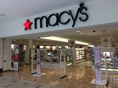 A macy 's store with a red star on the top of it