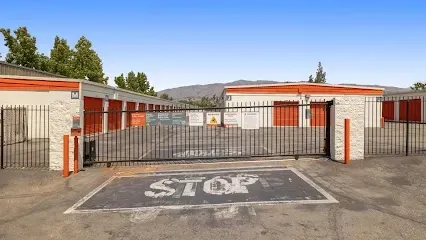 A stop sign is painted on the side of a parking lot.