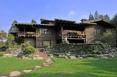 A large house with a stone walkway leading to it