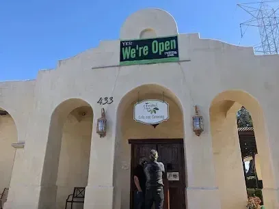 tree service close to me-Restaurant exterior with arched entrance, 