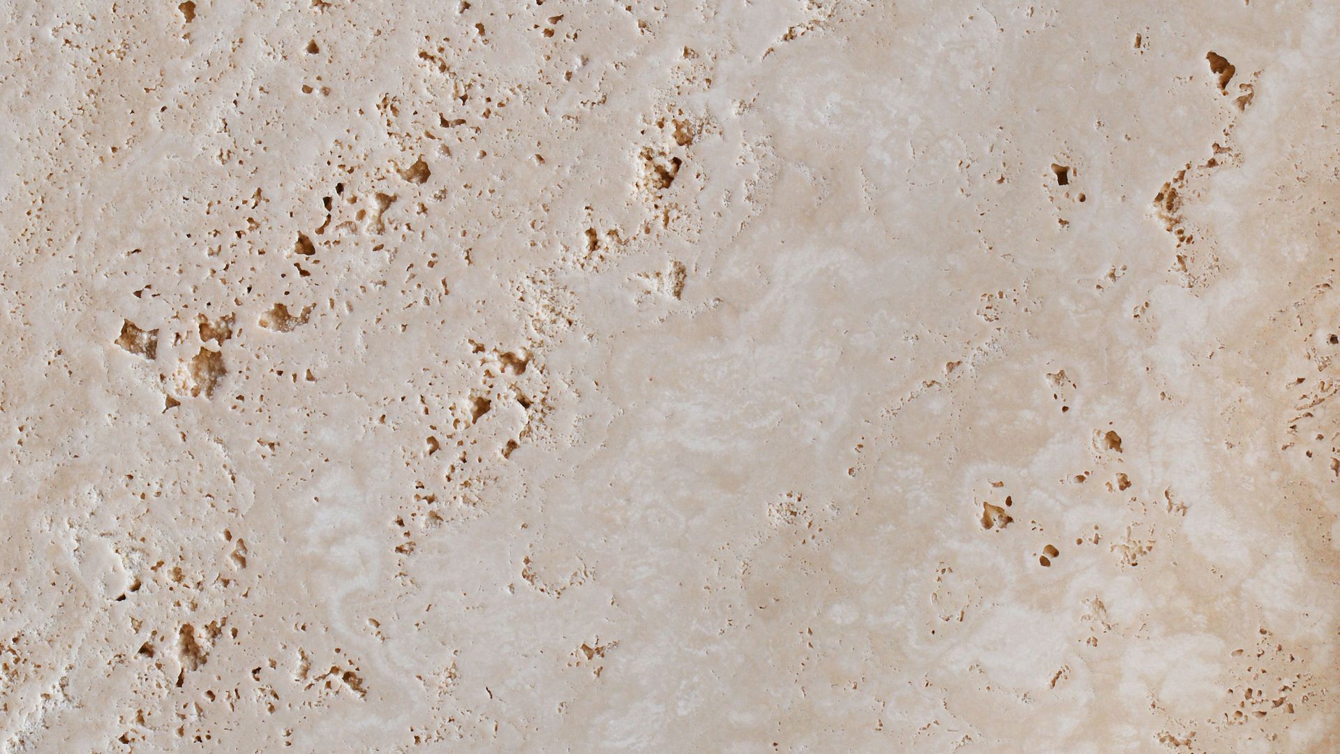 A close up of a concrete surface with holes in it