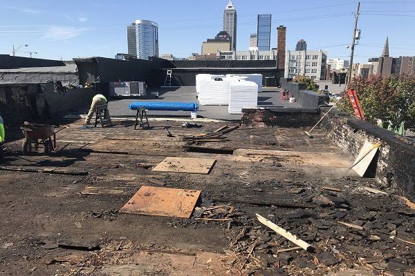 Roofer Installing Roof Tiles — Indianapolis, IN — Brown's Roofing, Inc. Roofer Installing Roof Tiles — Indianapolis, IN — Brown's Roofing, Inc.