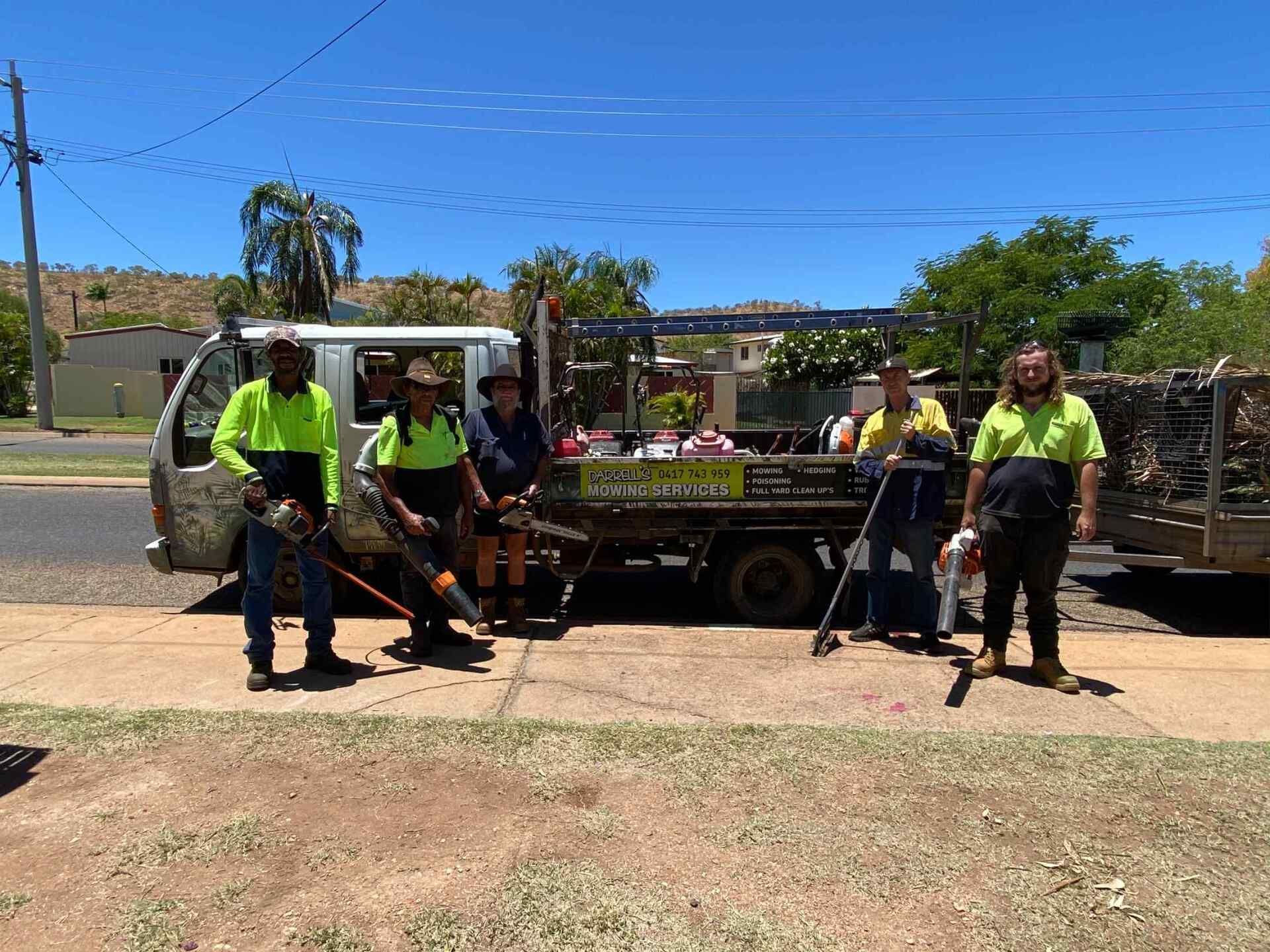 Group of People With Tools and Truck, Possibly Doing Yard Work — Darrell's Mowing Services in Sunset, QLD