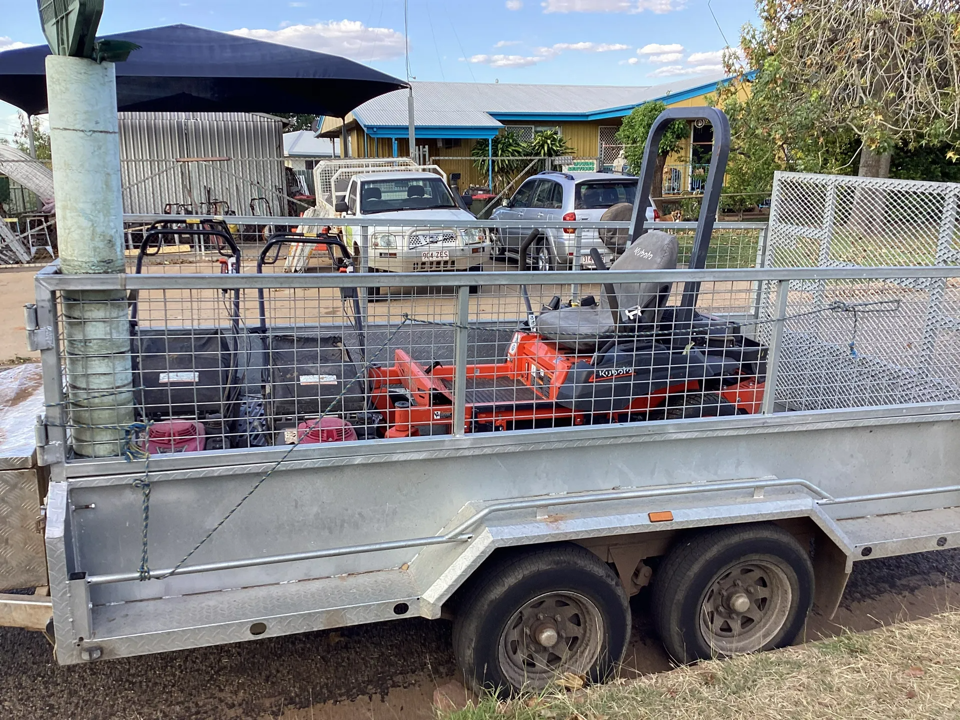 Trailer Loaded With Construction Equipment — Darrell's Mowing Services in Cloncurry, QLD