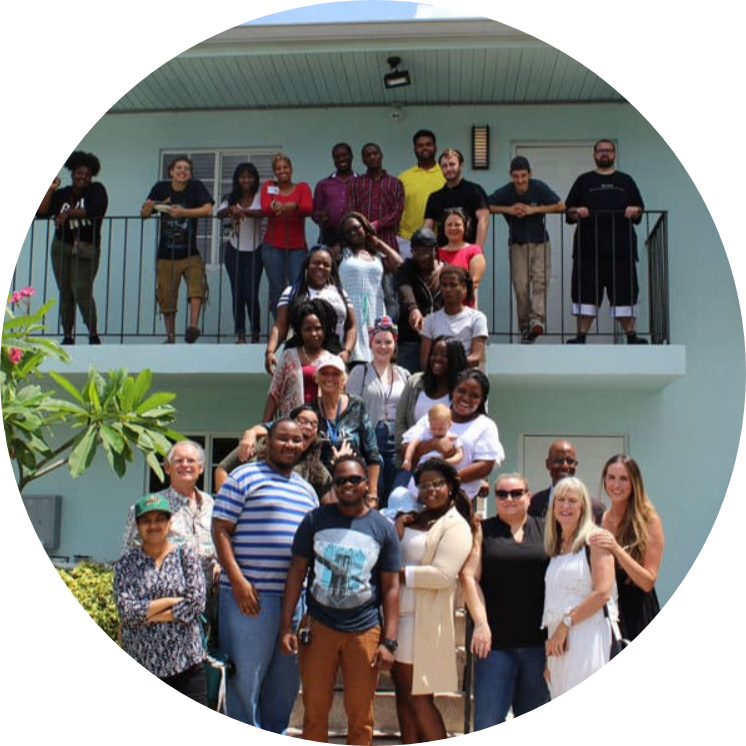 group shot in front of vita nova village