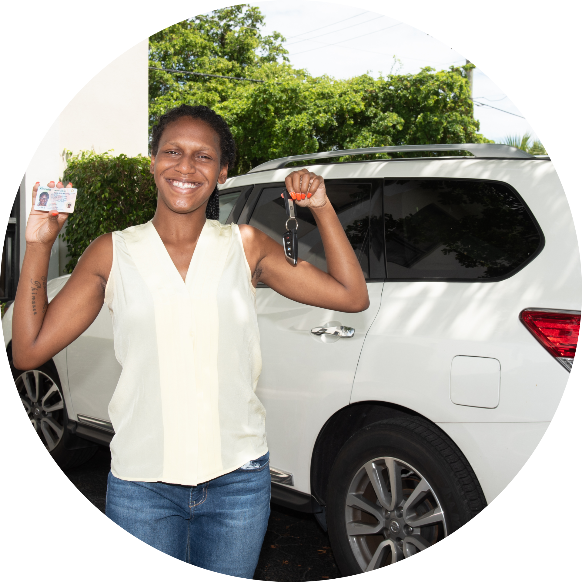 woman holding car keys and license