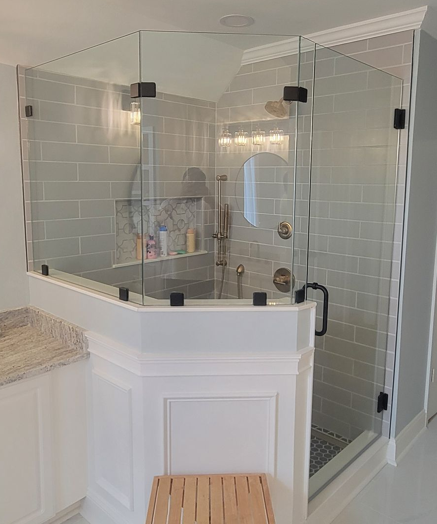 5 Ways Custom Shower Doors Can Level Up Your Bathroom Remodel
If you're planning a bathroom remodel here in the Triad, whether that's Kernersville, Greensboro, or Winston-Salem, you've probably already started browsing Pinterest boards and home improvement sites. And let's be honest: there's a lot to think about. Tiles, fixtures, lighting, storage... the list goes on.
But here's something we've learned after years of working with homeowners across North Carolina: the shower door you choose can completely transform your space. Not just make it look nicer (though it absolutely does that), but actually add real, measurable value to your home and your daily routine.
We're Kernersville Glass, and we've been helping folks in the Triad create bathrooms they're proud of for years. Today, we want to walk you through five specific ways custom shower doors can take your bathroom from