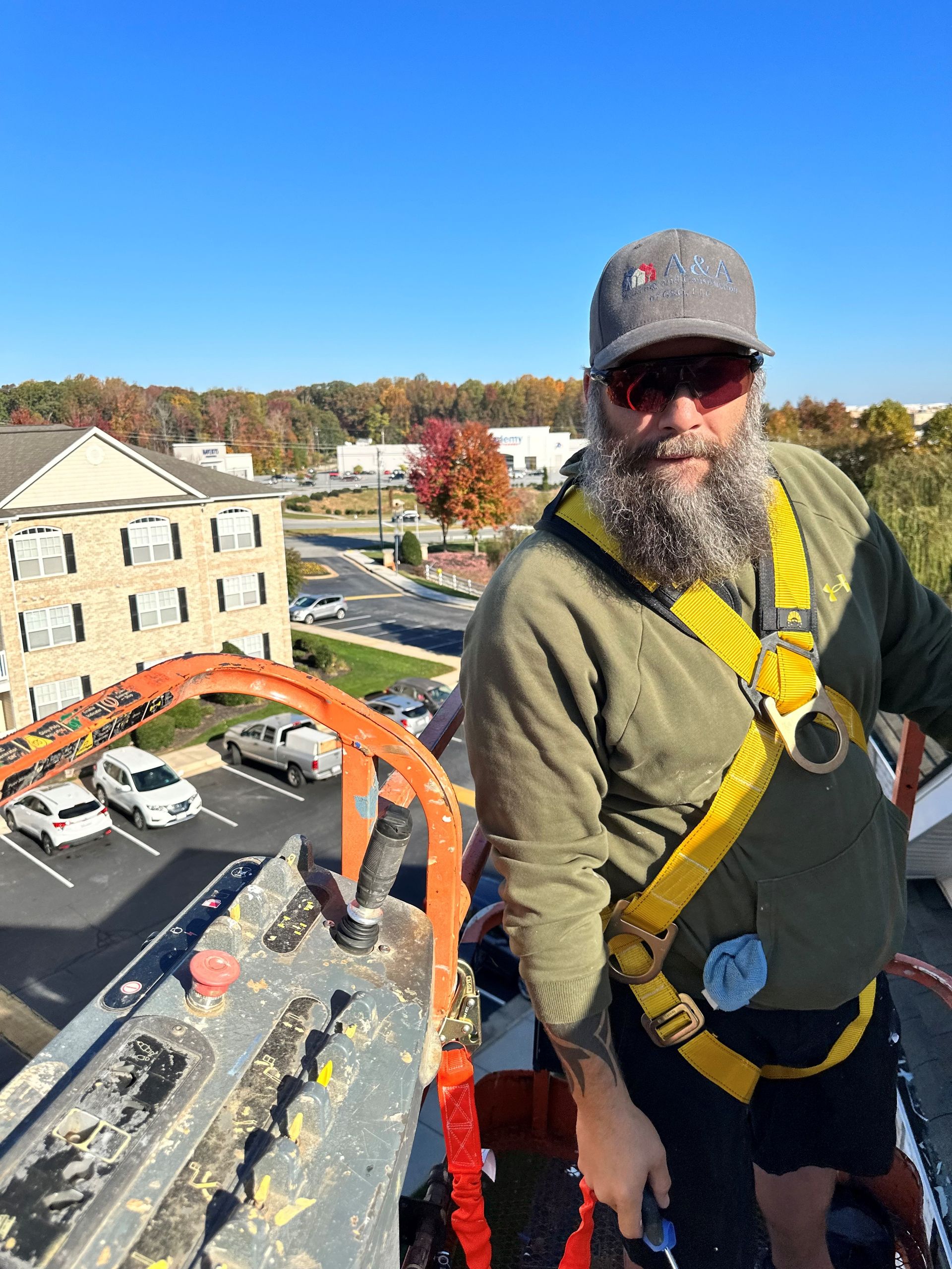 Worker at the roof deck - Greensboro, NC | A&A Painting Construction
