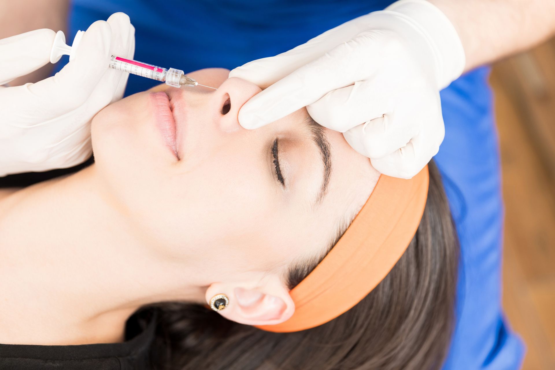 A Woman is Getting a Botox Injection in her Face  — Tustin, CA — Dr. Assif Med Spa