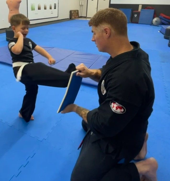 An aerial view of a city skyline at sunset.