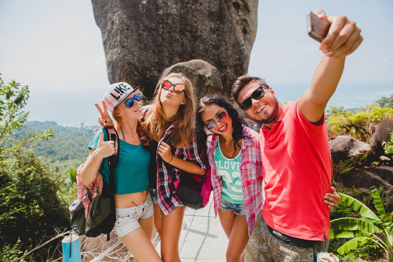 A group of young people are taking a selfie together.