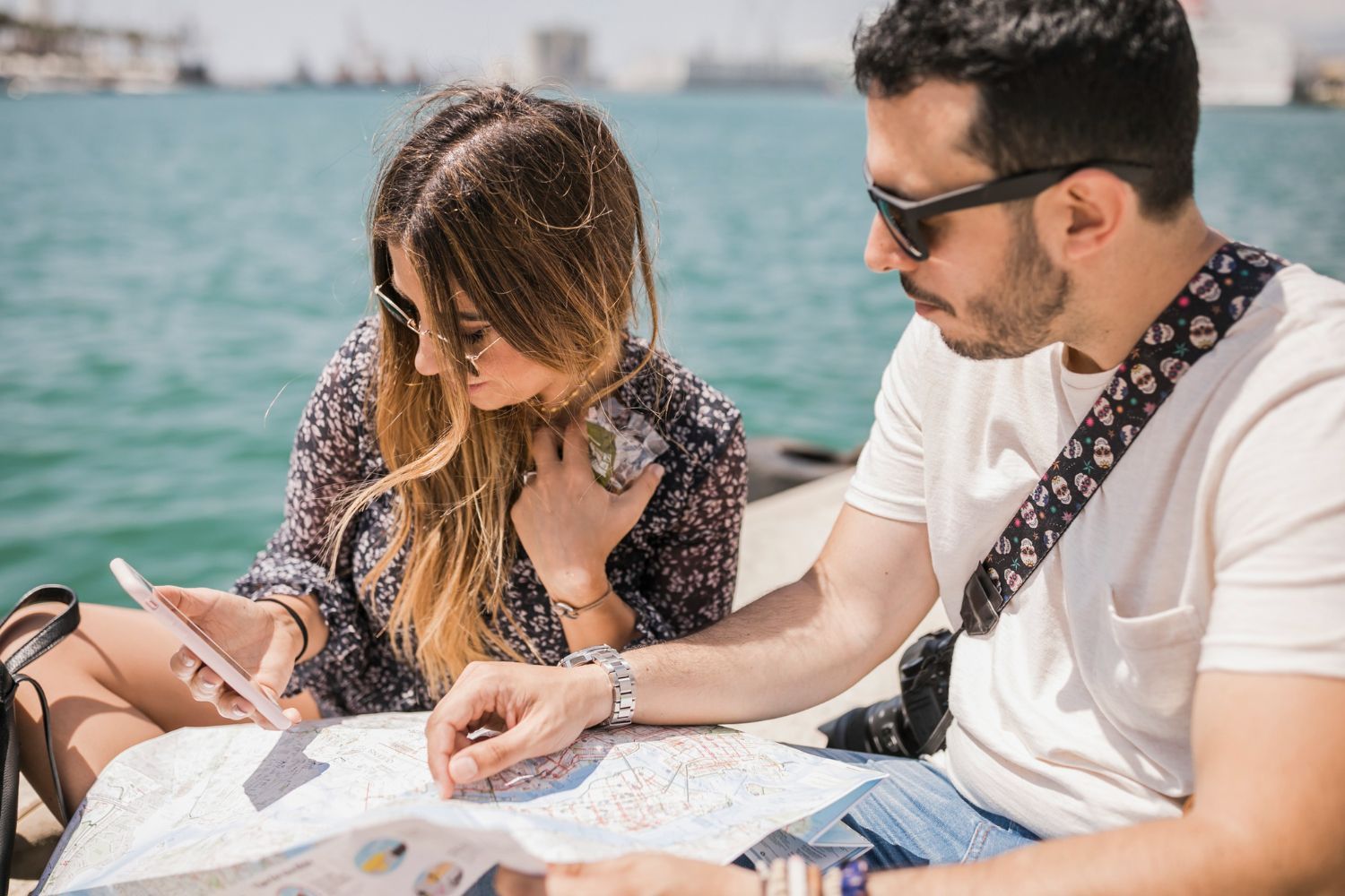 A man and a woman are looking at a map.