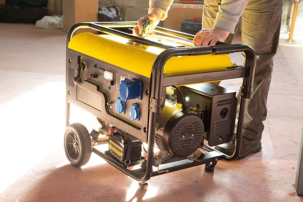 A man is working on a generator in a garage.