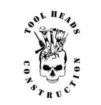 Black and white logo of a skull with various construction tools emerging from its cracked top, labeled