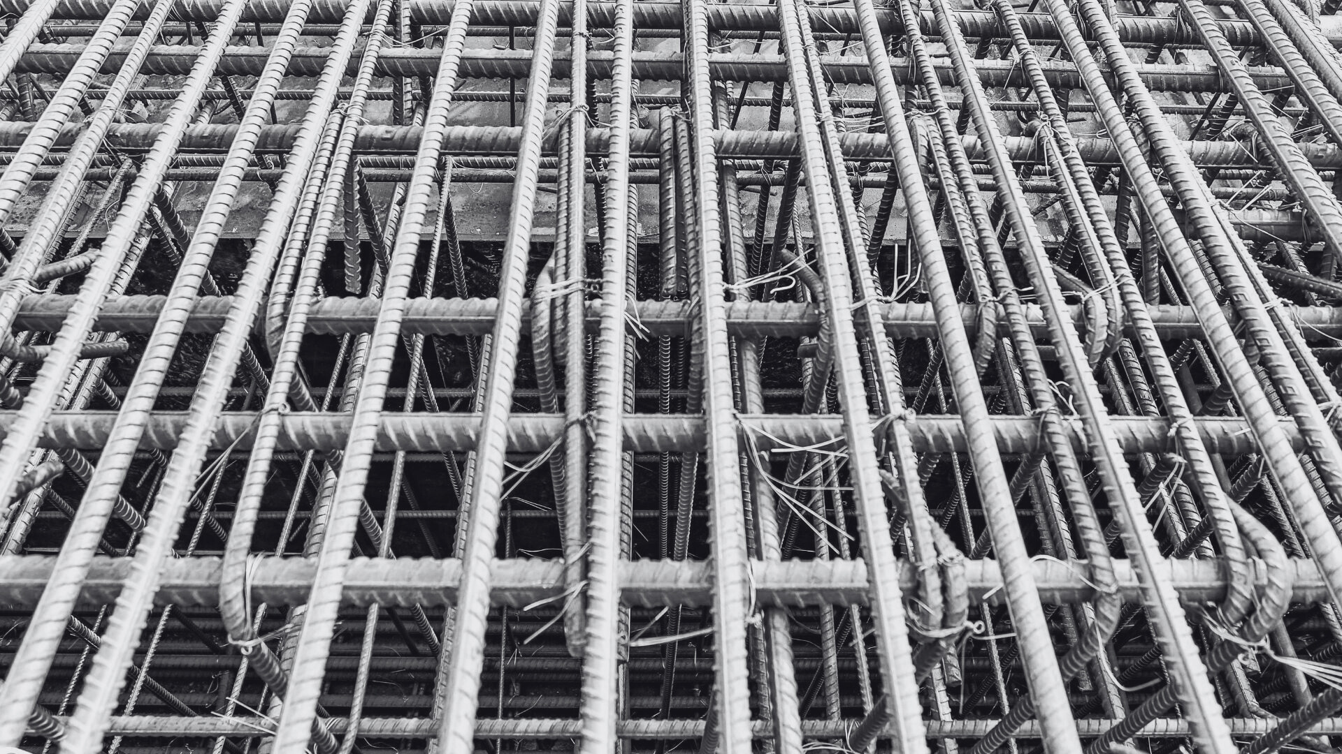 A close up of a metal grid on a construction site.