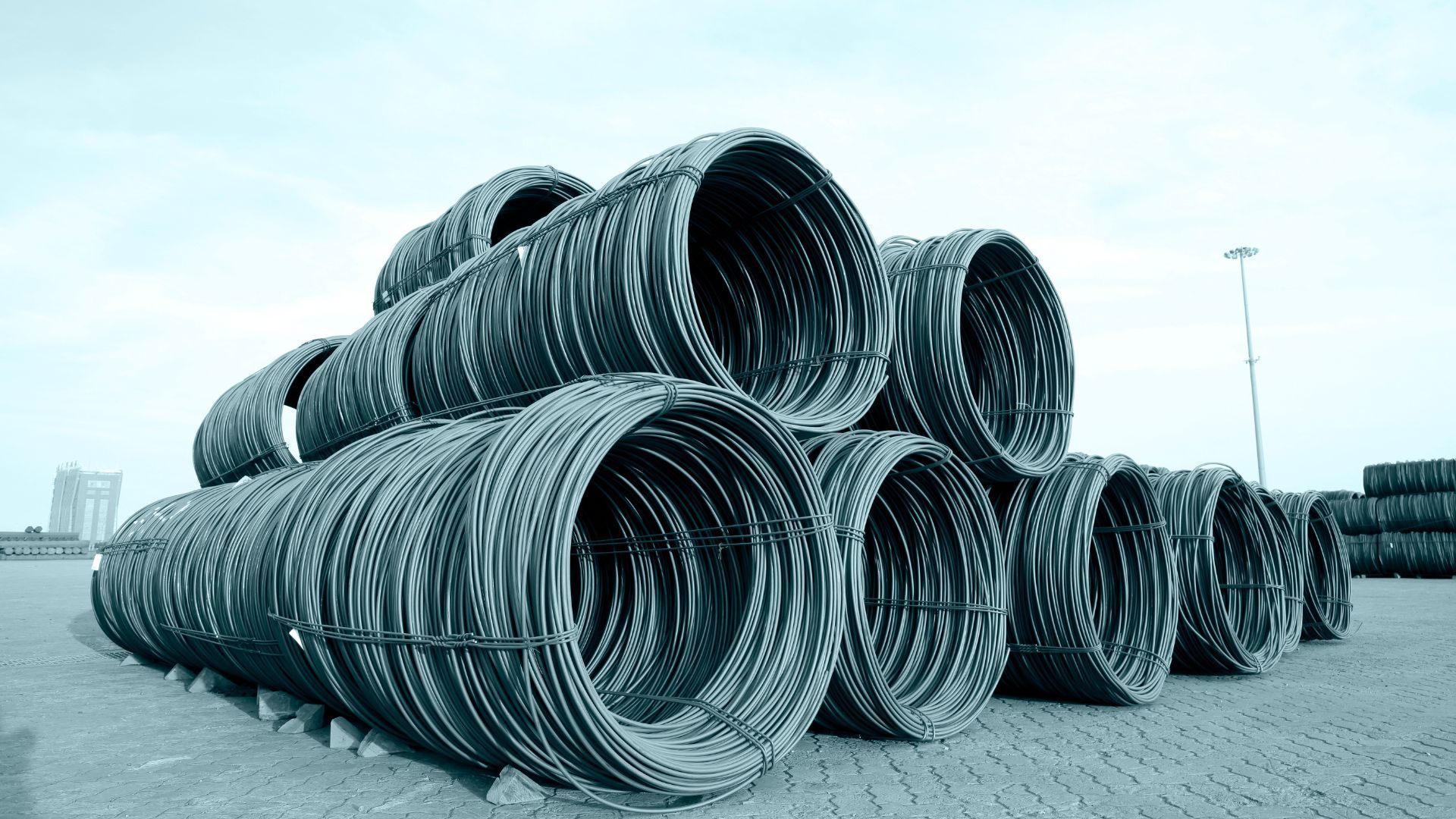 A bunch of metal pipes are stacked on top of each other