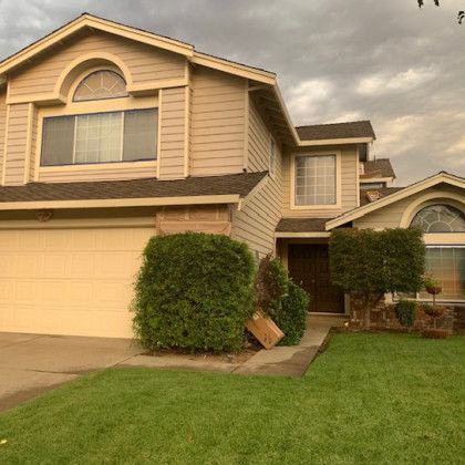 A large house with a large lawn in front of it