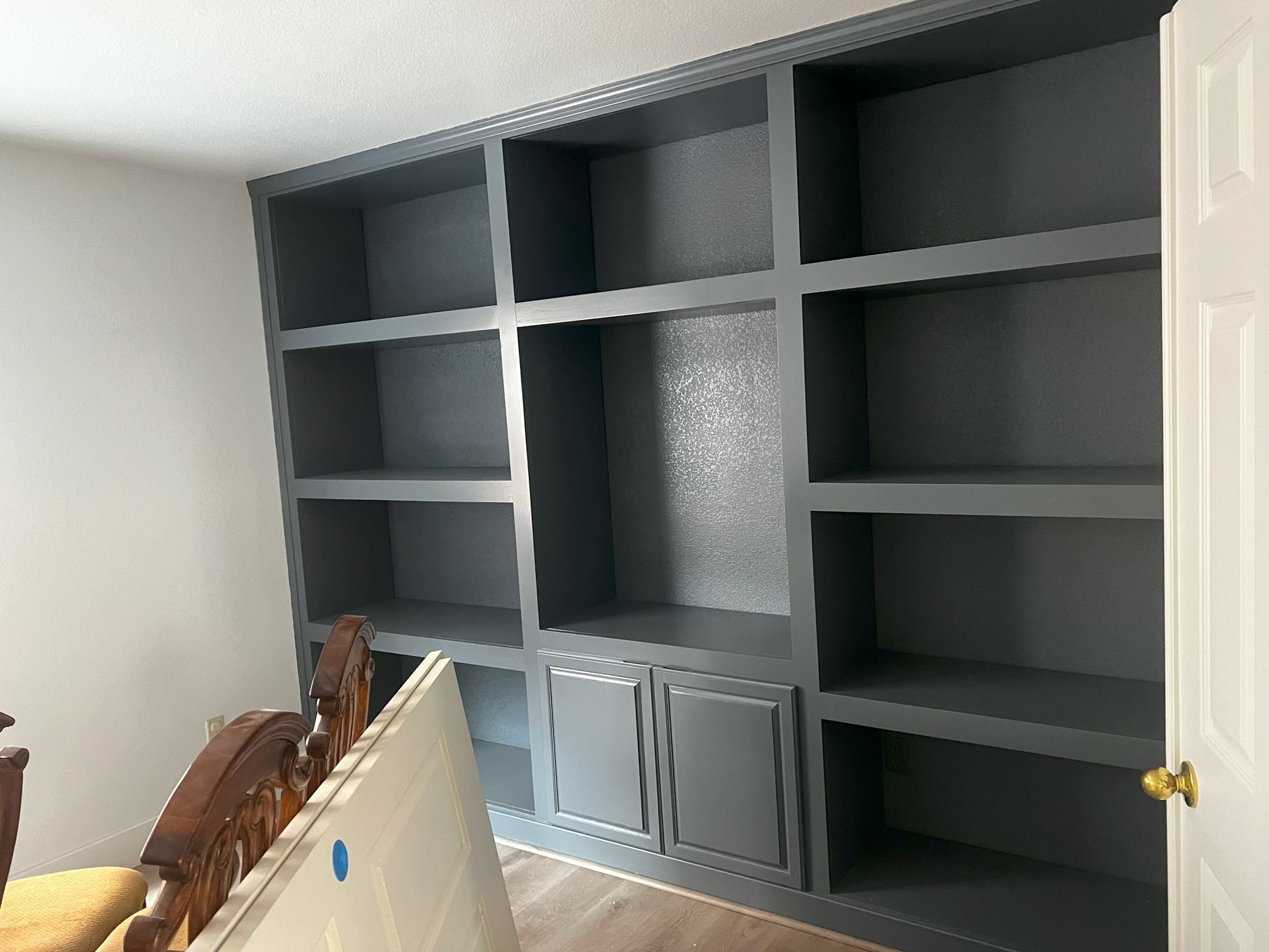 A room with a lot of shelves and cabinets