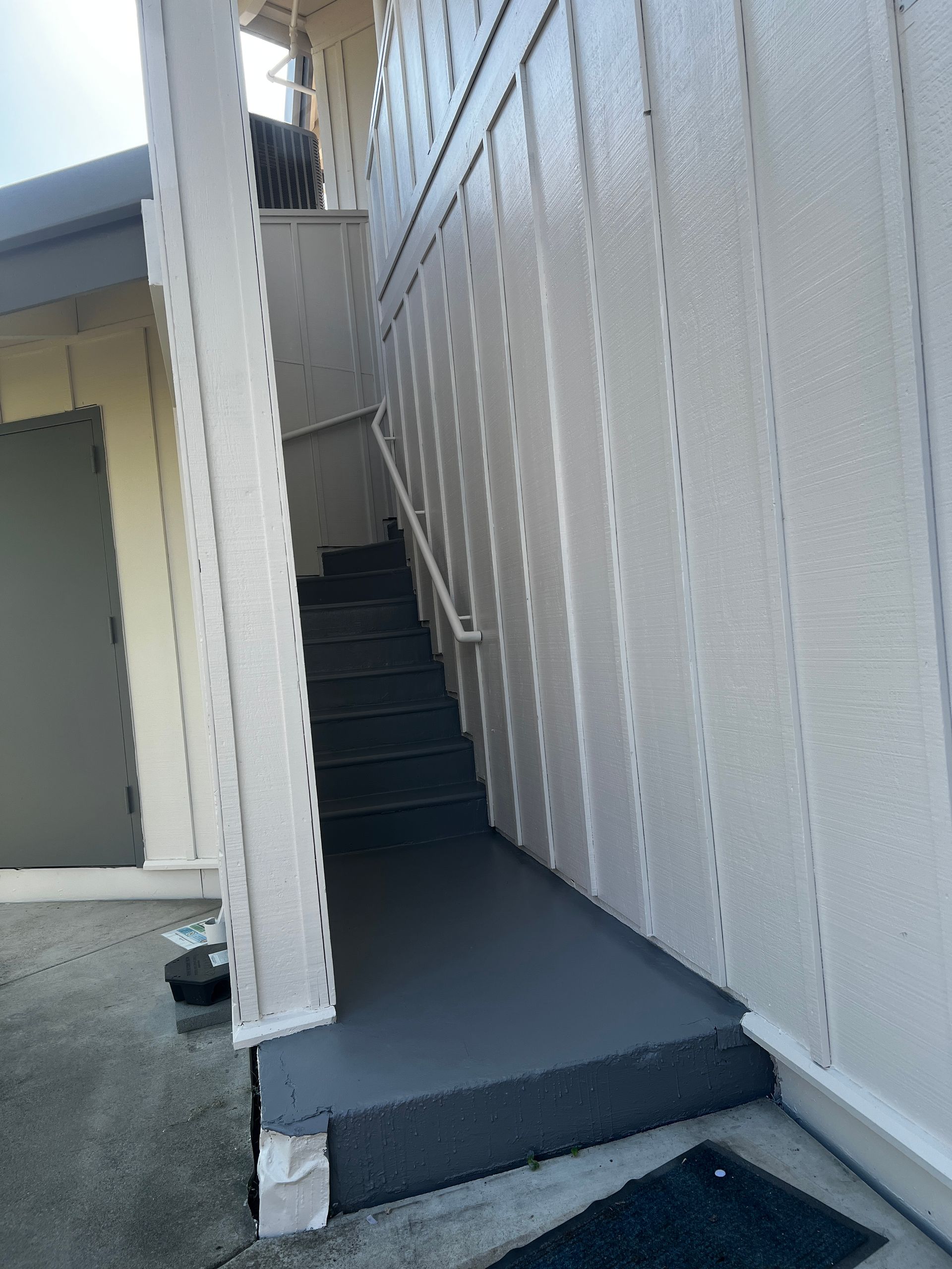 A set of stairs leading up to the second floor of a building