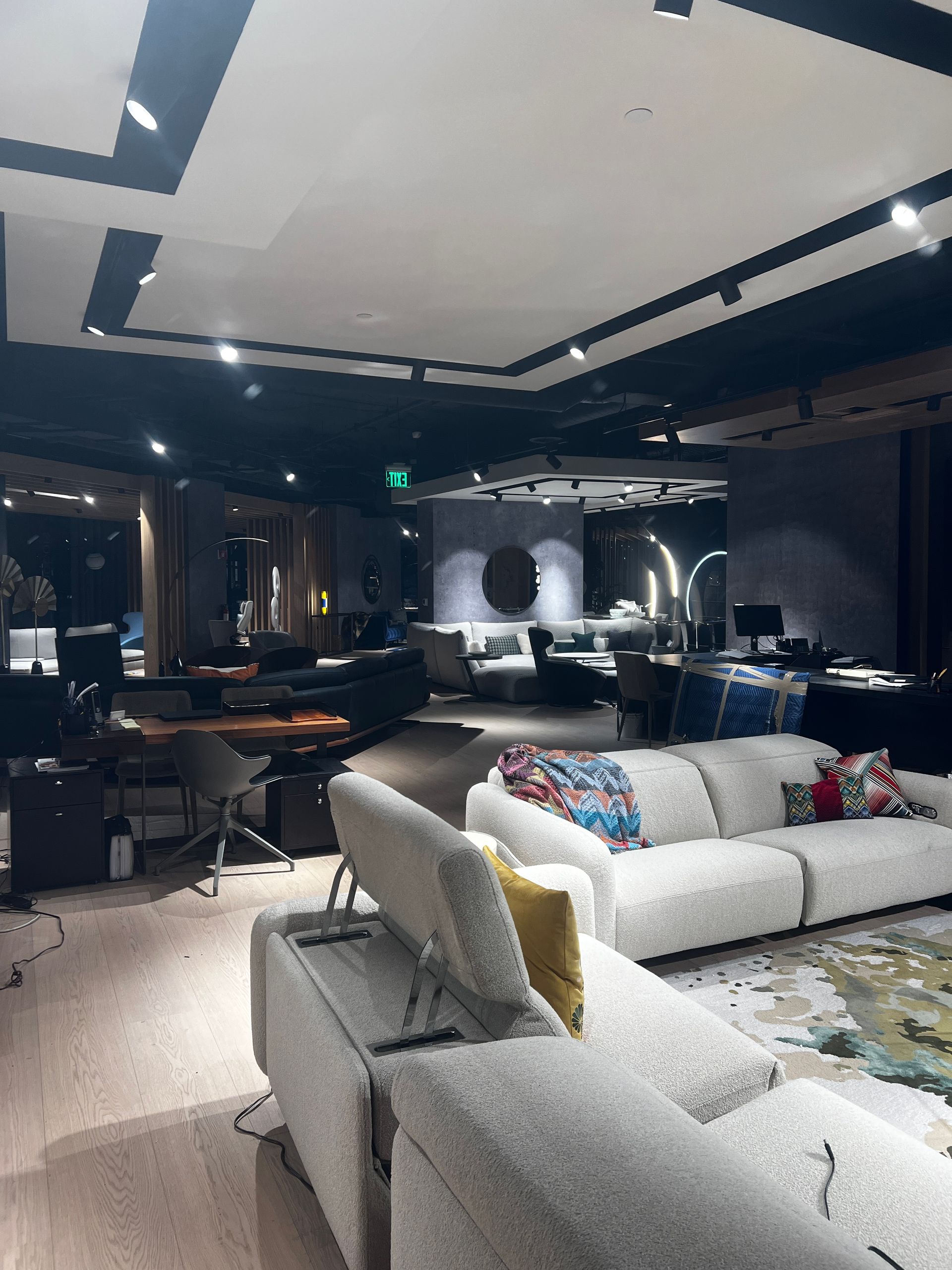 A living room filled with furniture and a large white couch.