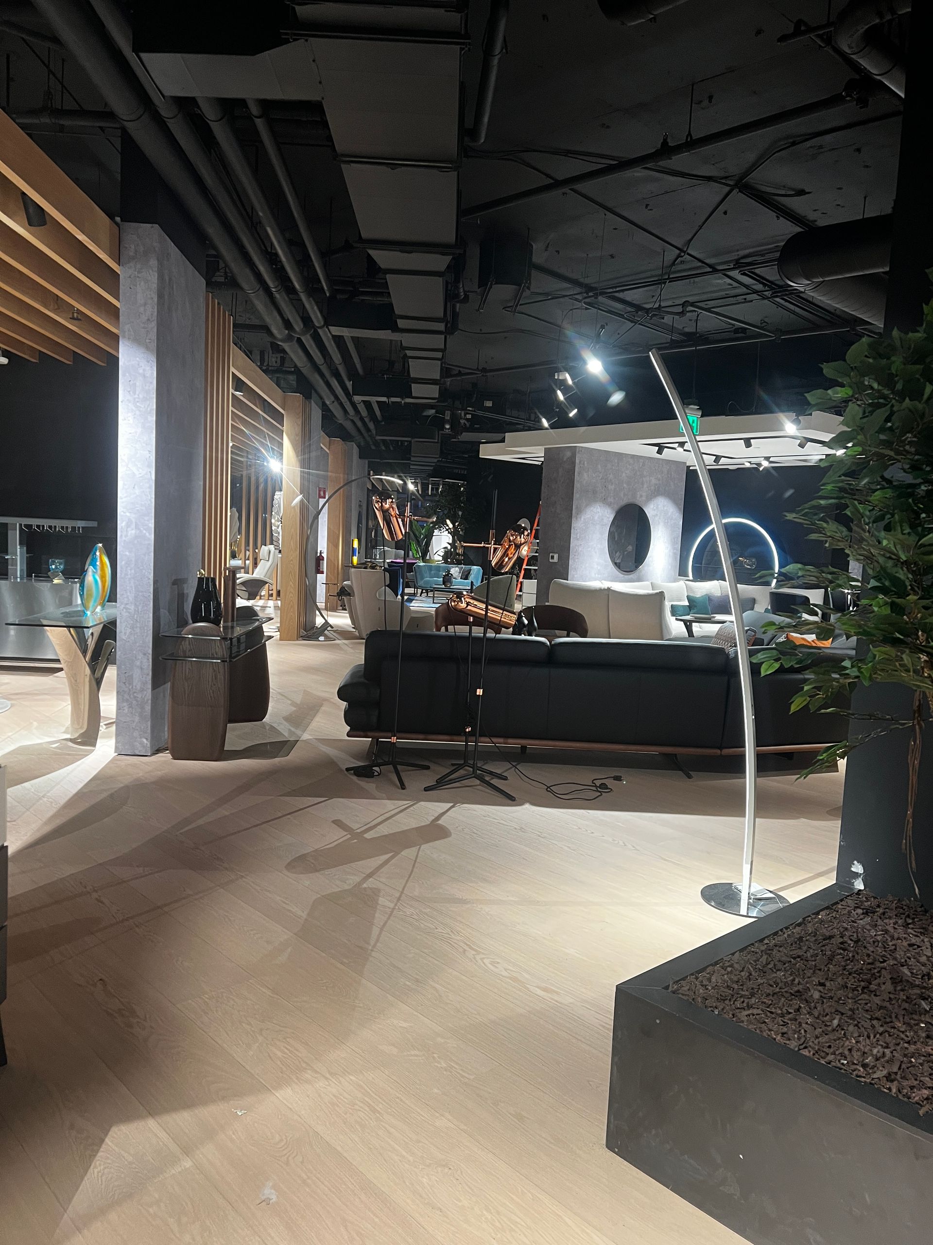 A large room with a couch and chairs in it