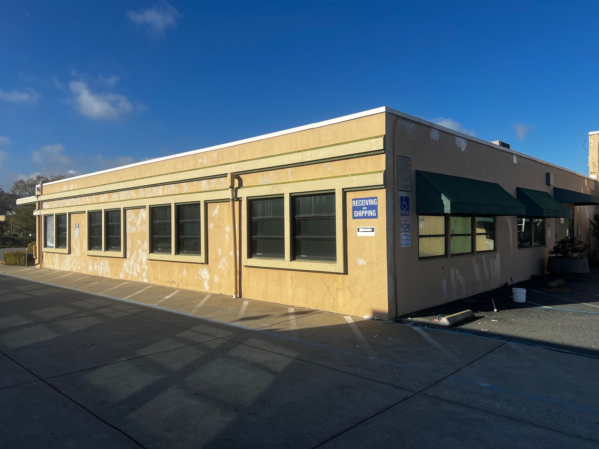 A large building with a lot of windows and awnings