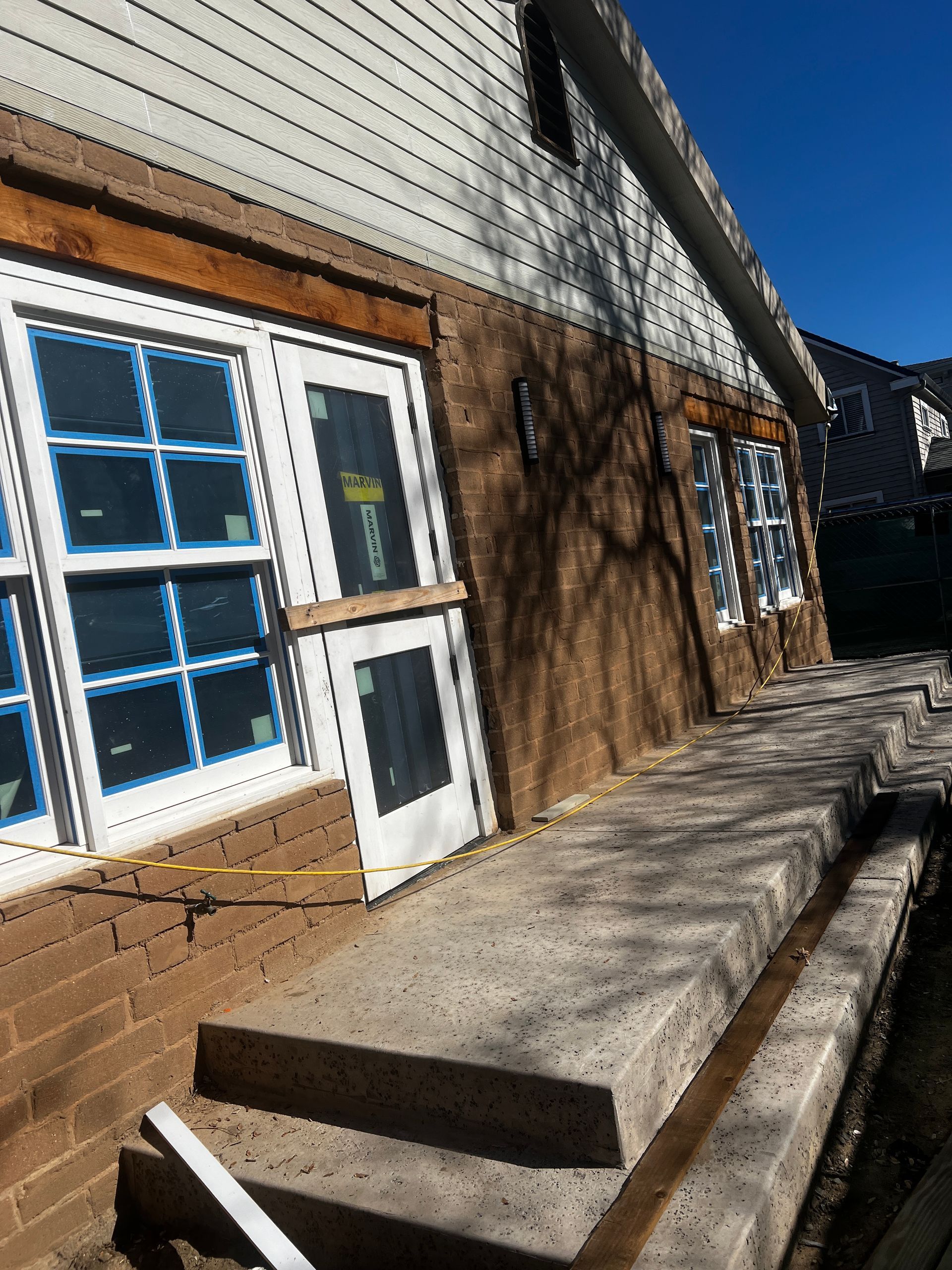 A house with a lot of windows and stairs