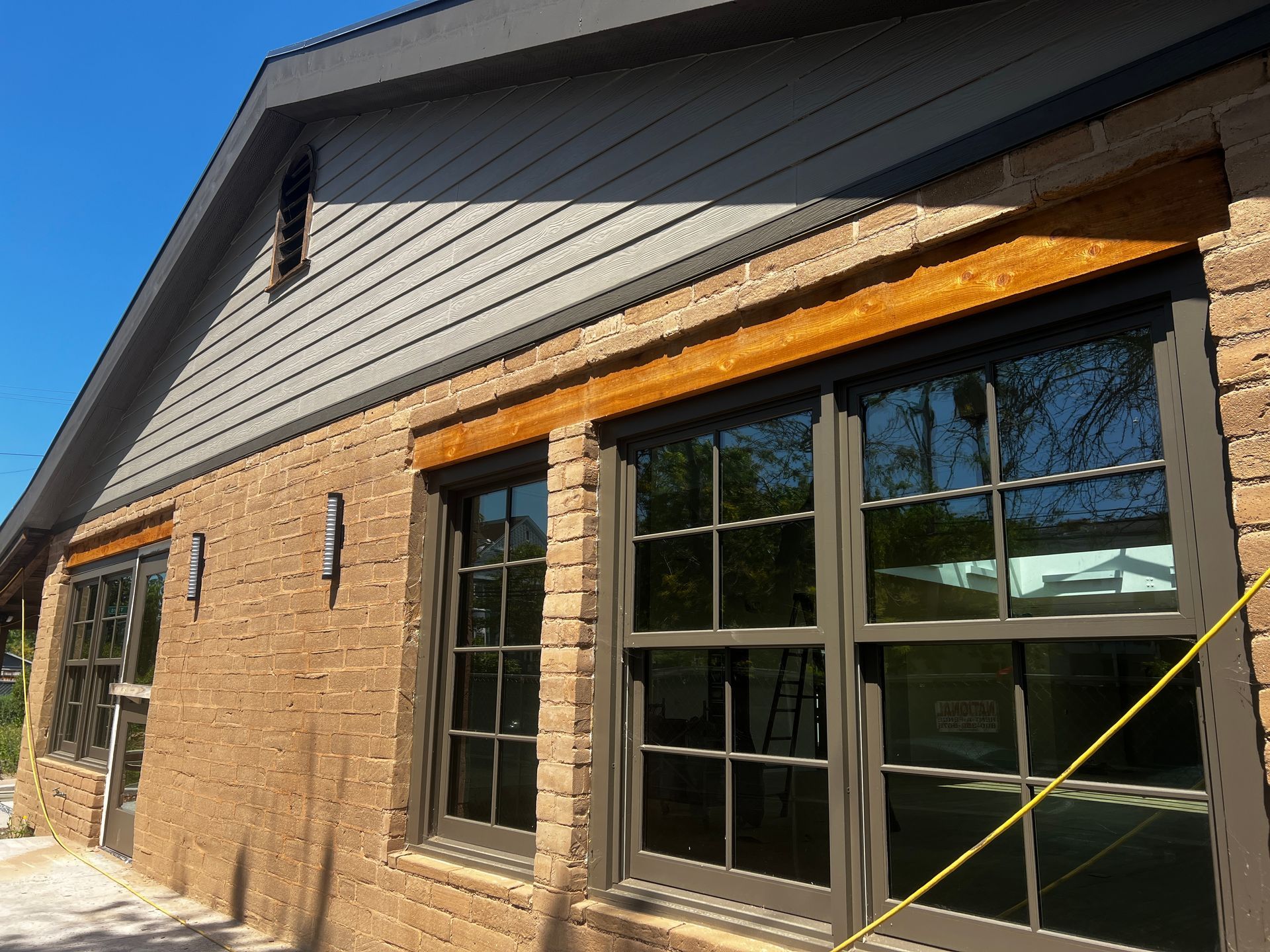 A brick building with a lot of windows on it