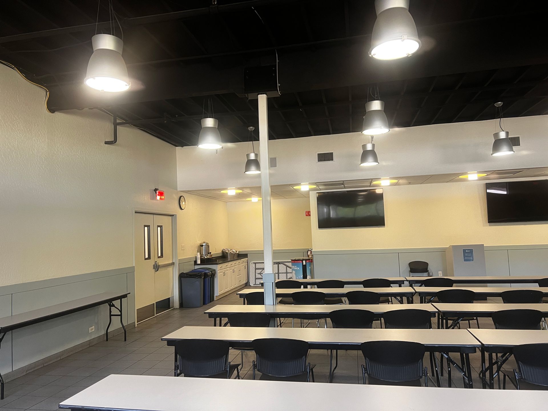 A large room with tables and chairs in it