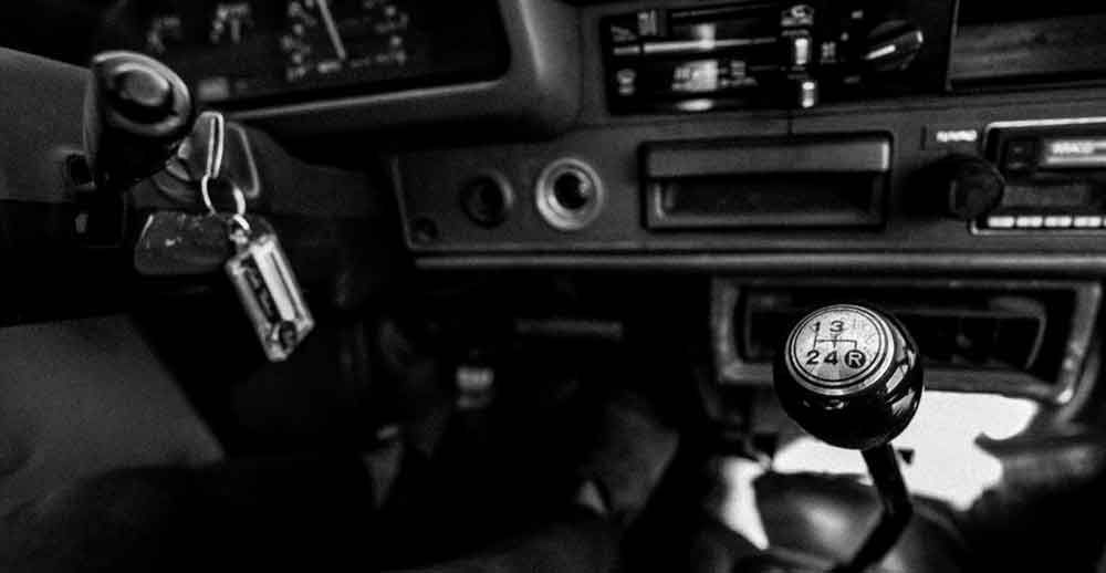A black and white photo of the interior of a car.